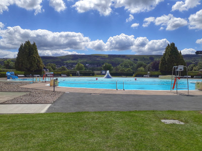Outdoor pool with hills in background