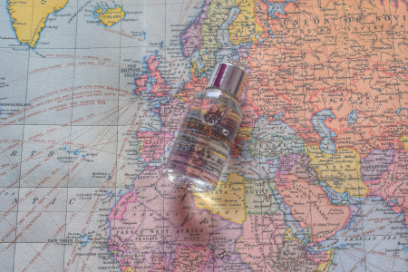 Lone bottle of body wash with map background